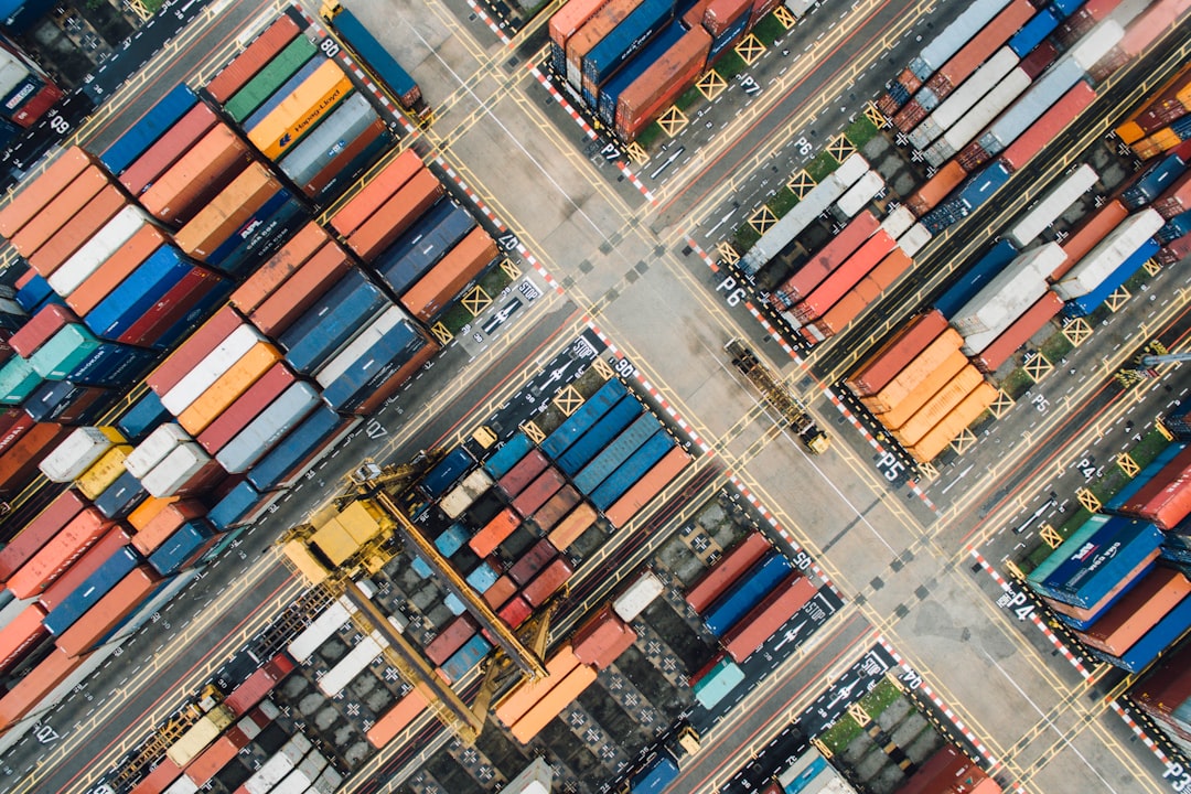 Shipping containers stacked at a busy port