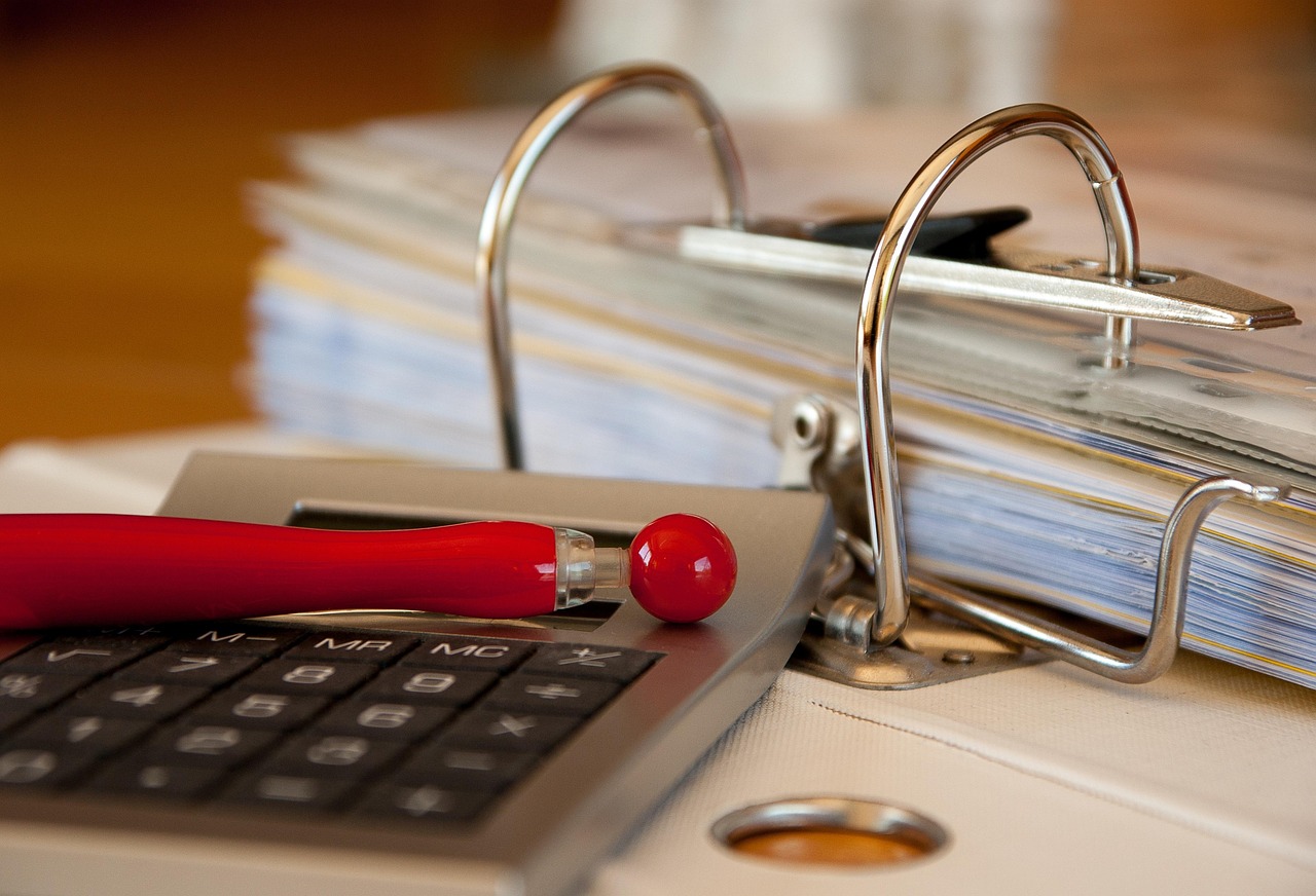Filing cabinet drawer filled with organized paper document folders