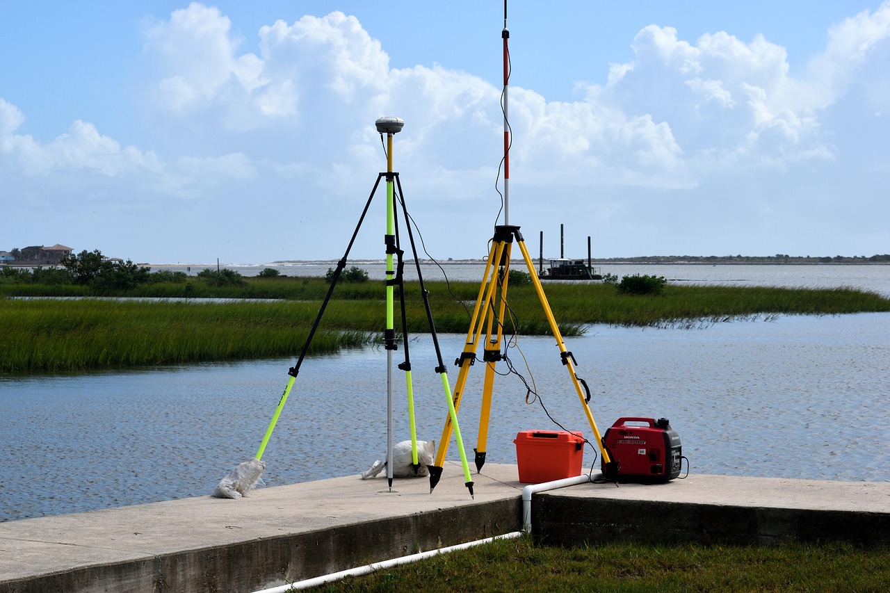 An engineer using surveying equipment on site to check technical specifications