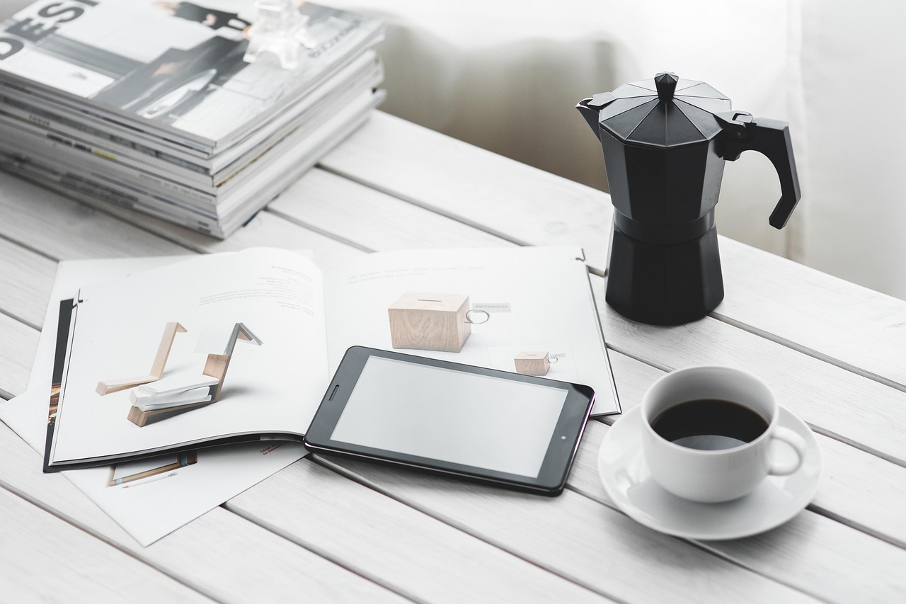 A small business owner reviewing paperwork and a contract document at a desk